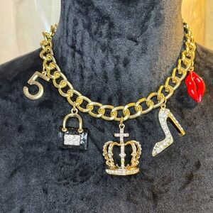 Gold Charm Necklace with Black and Red Accents